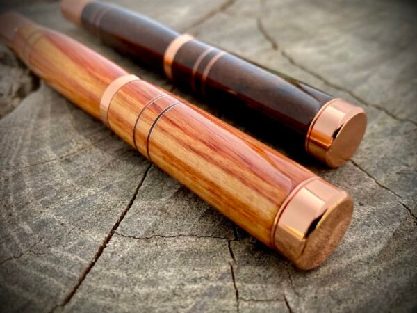 A pair of handmade wooden pens with Copper Bands